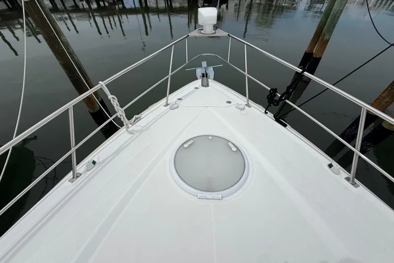 Slide: The Image of Bow view of 2008 Cruisers Yachts 330 Express at dock, featuring railing and hatch. - 29