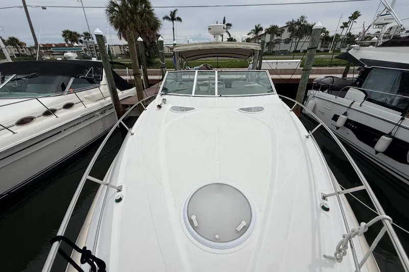 Slide: The Image of 2008 Cruisers Yachts 330 Express docked, showcasing sleek design and spacious deck. - 31