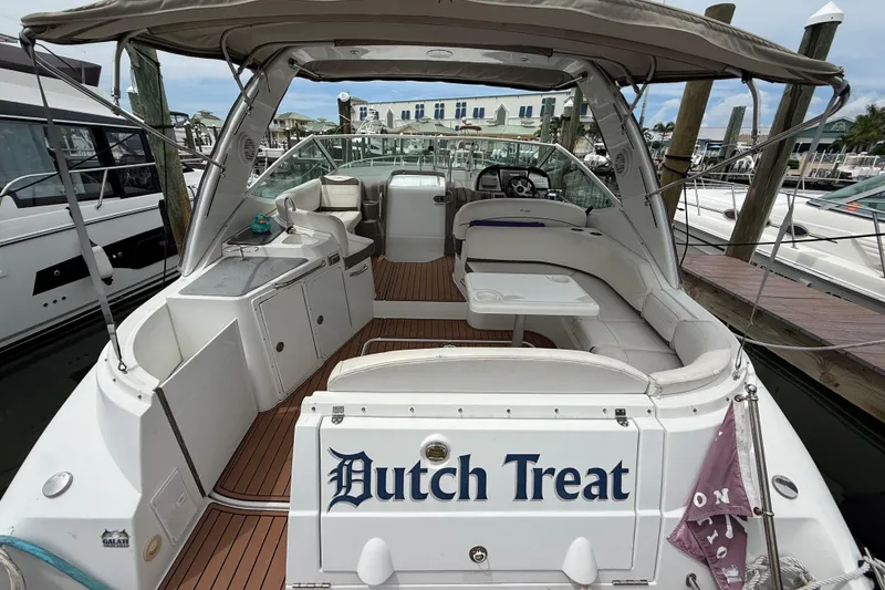 Slide: The Image of 2008 Cruisers Yachts 330 Express docked, featuring spacious seating and sleek design. - 4