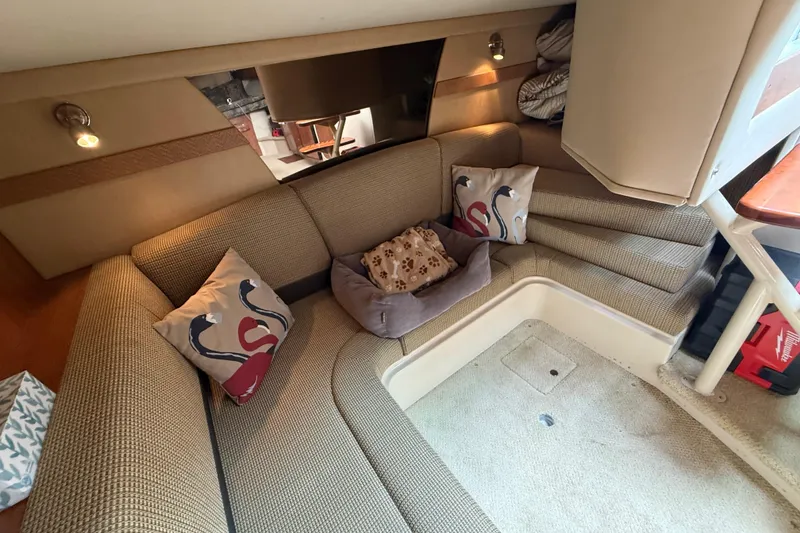 Slide: The Image of 2008 Cruisers Yachts 330 Express interior with cozy seating and decorative pillows. - 44