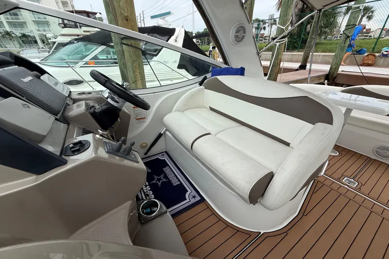 Slide: The Image of 2008 Cruisers Yachts 330 Express interior with helm and seating area. - 54