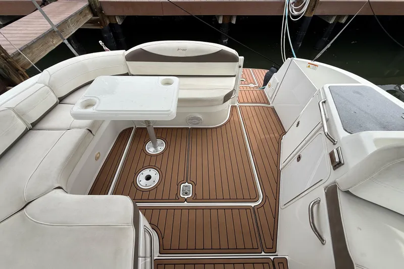 Slide: The Image of 2008 Cruisers Yachts 330 Express boat interior with seating and table. - 56