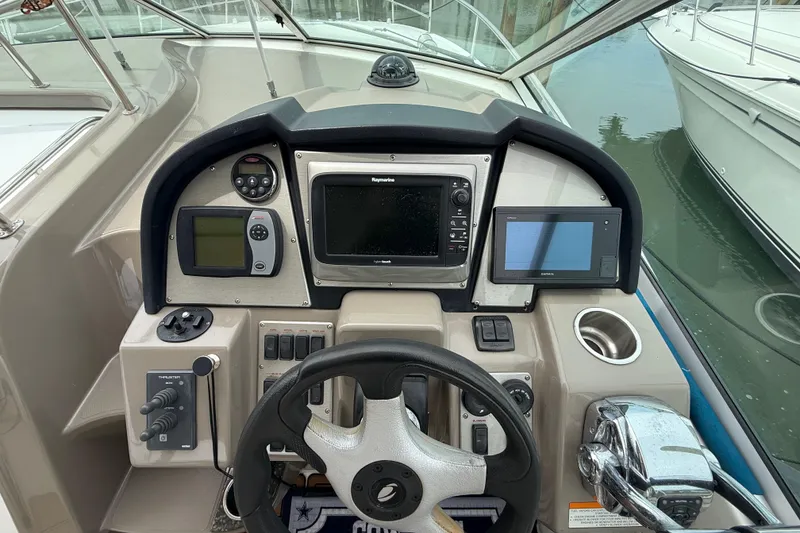 Slide: The Image of 2008 Cruisers Yachts 330 Express helm with navigation and control systems. - 18