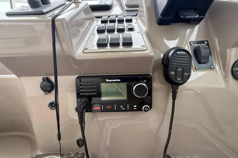 Slide: The Image of Control panel of 2008 Cruisers Yachts 330 Express with Raymarine equipment. - 23