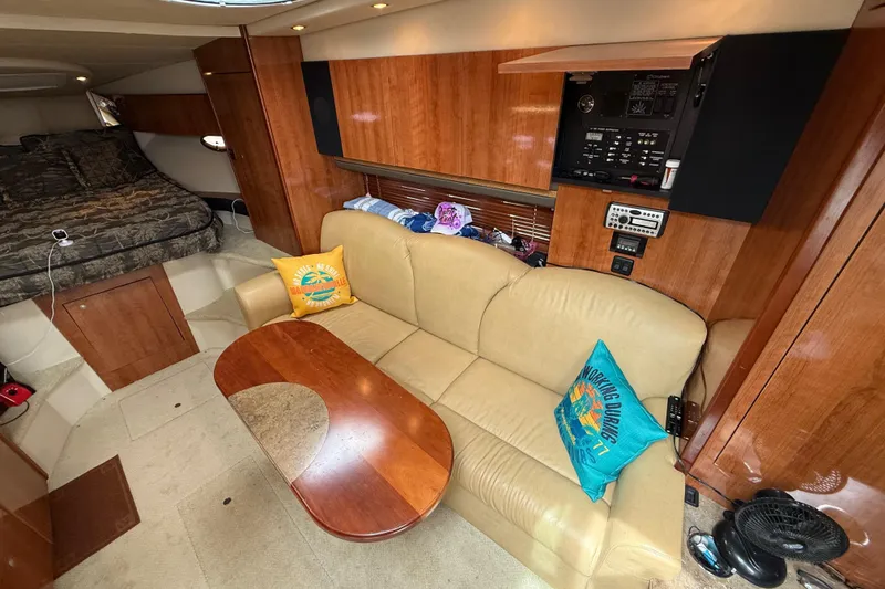 Slide: The Image of Interior of 2008 Cruisers Yachts 330 Express with beige sofa and wooden accents. - 39