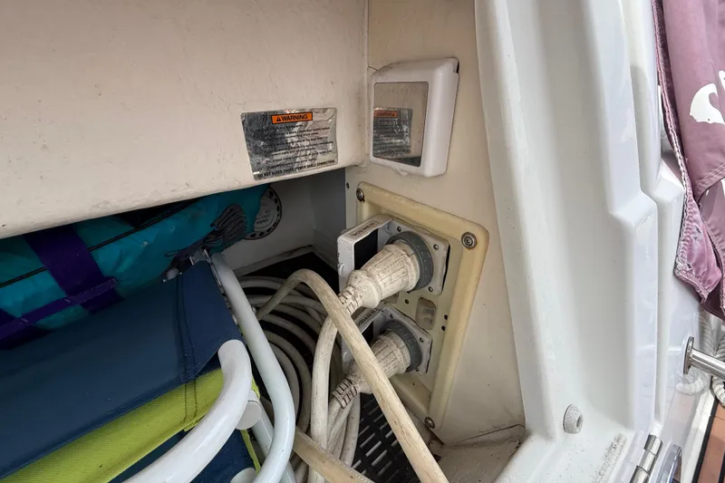 Slide: The Image of 2008 Cruisers Yachts 330 Express electrical connections and storage area. - 7