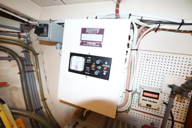 Slide: The Image of Electrical panel in a 1993 Grand Banks 46 Classic boat engine room. - 102