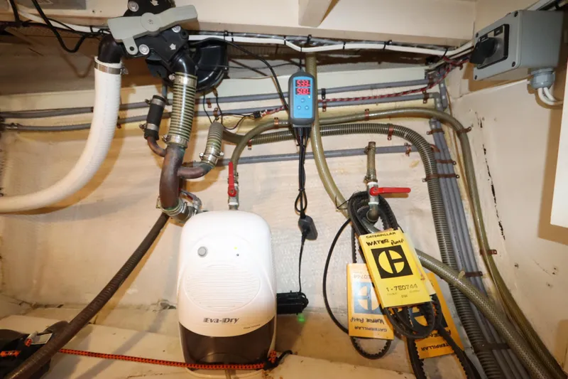 Slide: The Image of Engine room of 1993 Grand Banks 46 Classic with Eva-Dry dehumidifier and water pump. - 103