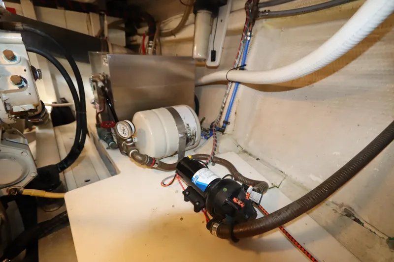 Slide: The Image of Engine room of 1993 Grand Banks 46 Classic yacht with mechanical components. - 104