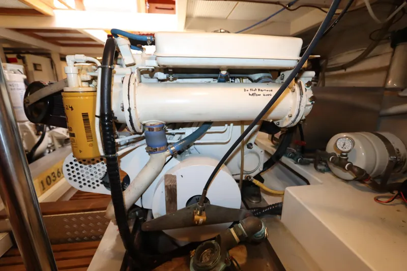 Slide: The Image of Engine room of 1993 Grand Banks 46 Classic yacht, showcasing mechanical components. - 107