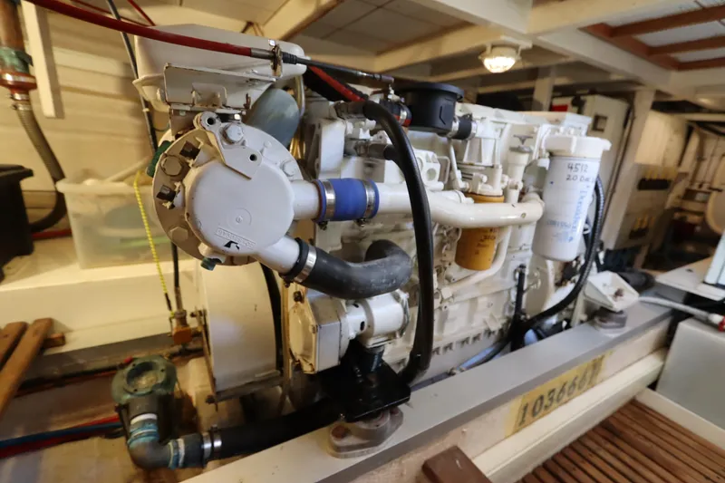 Slide: The Image of Engine room of 1993 Grand Banks 46 Classic yacht, showcasing detailed machinery components. - 111