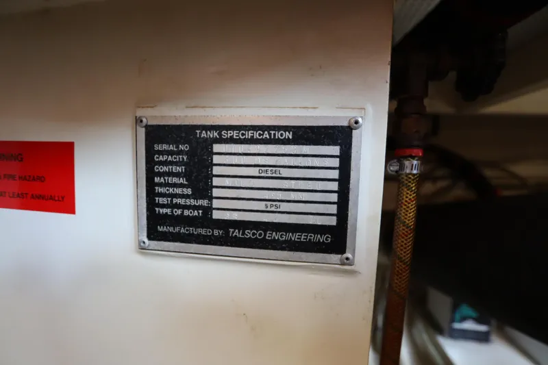 Slide: The Image of Tank specification label on 1993 Grand Banks 46 Classic, diesel content, manufactured by Talsco Engineering. - 114