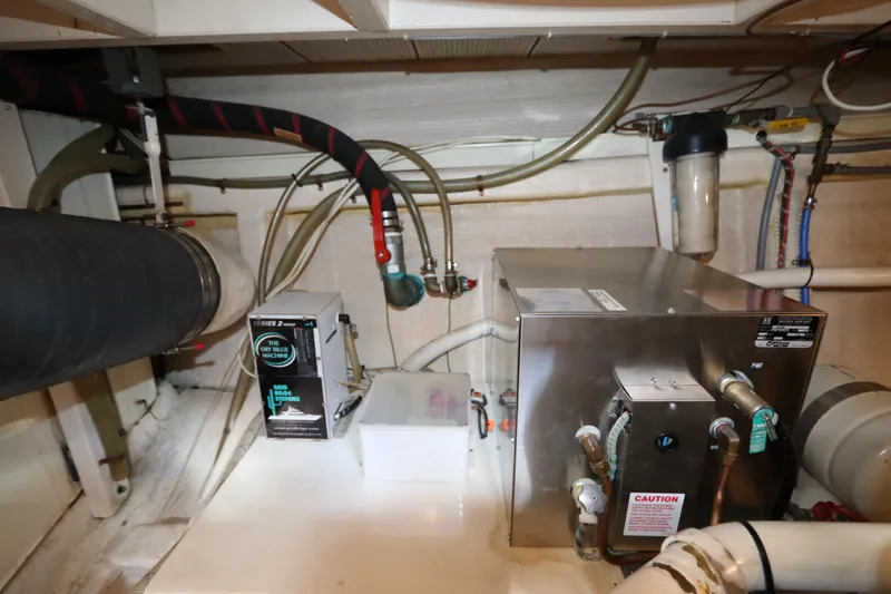 Slide: The Image of Engine room of 1993 Grand Banks 46 Classic yacht with machinery and piping. - 120