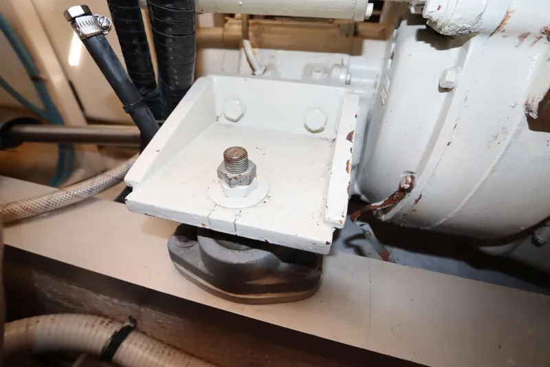 Slide: The Image of Engine component of a 1993 Grand Banks 46 Classic boat, featuring a metal mount. - 126