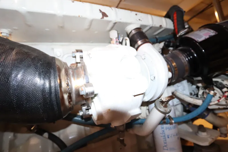 Slide: The Image of Engine compartment of 1993 Grand Banks 46 Classic yacht, showcasing mechanical components. - 128