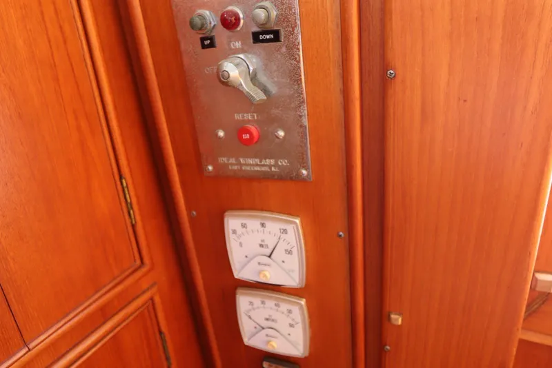 Slide: The Image of Control panel on 1993 Grand Banks 46 Classic yacht with wooden finish and gauges. - 129