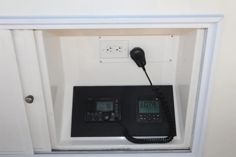 Slide: The Image of Control panel with radio and microphone on 1993 Grand Banks 46 Classic yacht. - 27