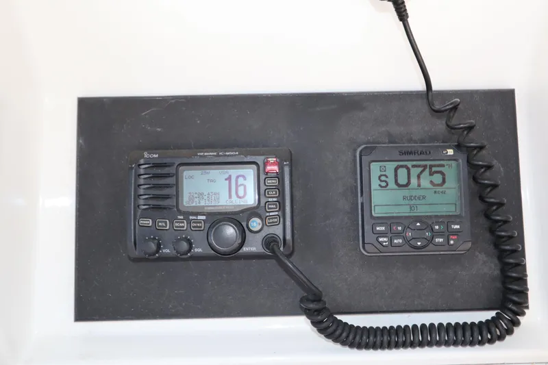 Slide: The Image of VHF marine radio and Simrad rudder display on 1993 Grand Banks 46 Classic yacht. - 28