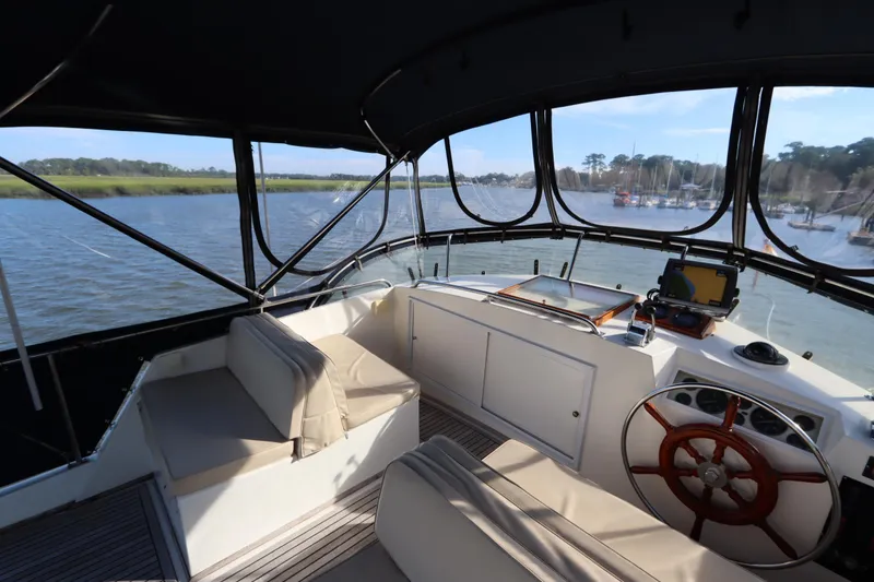 Slide: The Image of Interior view of 1993 Grand Banks 46 Classic yacht helm with scenic waterway. - 36
