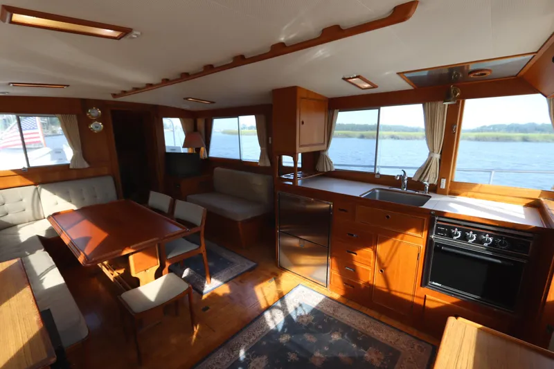 Slide: The Image of Interior of 1993 Grand Banks 46 Classic yacht with wood finish and dining area. - 41