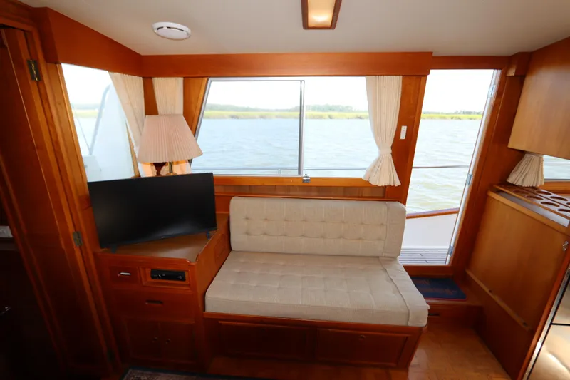 Slide: The Image of Interior of 1993 Grand Banks 46 Classic yacht with seating and window view. - 44