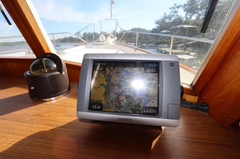 Slide: The Image of Navigation equipment on 1993 Grand Banks 46 Classic yacht, featuring Garmin GPS and compass. - 47