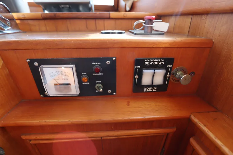 Slide: The Image of Control panel of a 1993 Grand Banks 46 Classic boat with switches and gauges. - 52