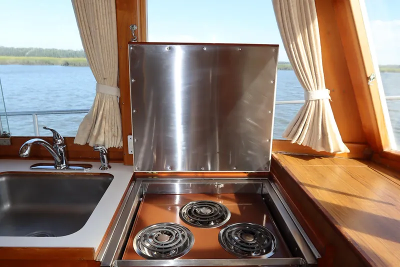 Slide: The Image of Kitchen area of 1993 Grand Banks 46 Classic yacht with stove and sink. - 63
