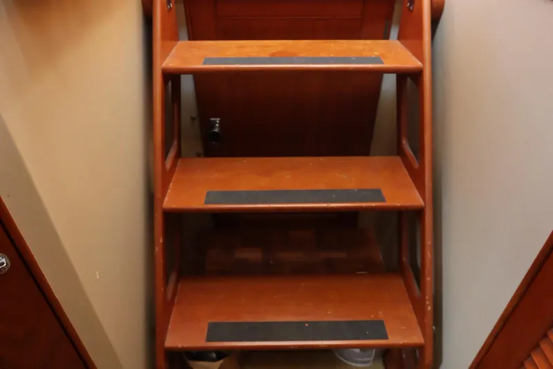Slide: The Image of Wooden stairs inside a 1993 Grand Banks 46 Classic yacht. - 64