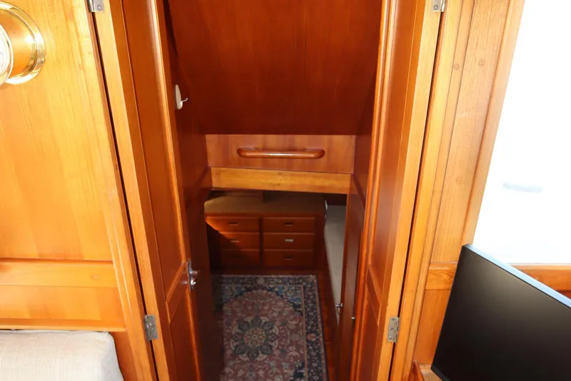 Slide: The Image of Interior of 1993 Grand Banks 46 Classic yacht with wooden cabinetry and carpet. - 72