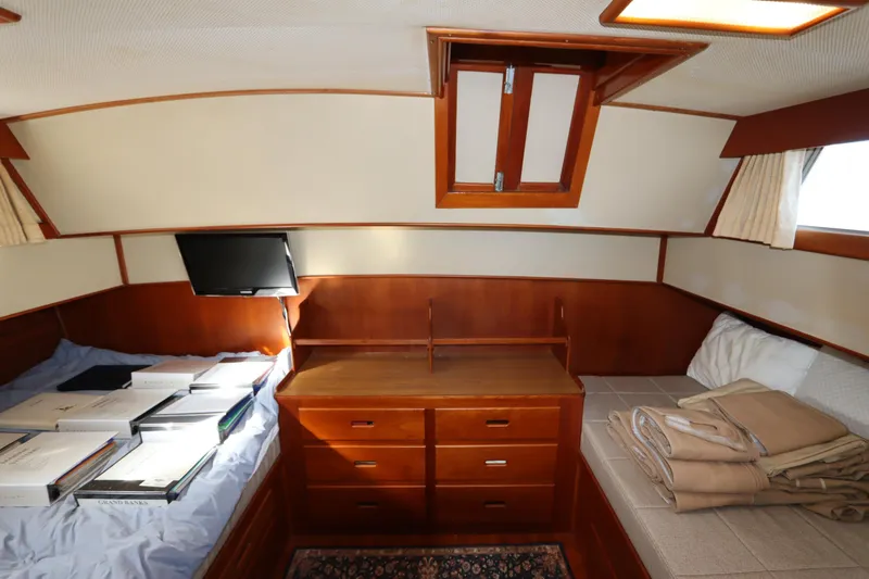 Slide: The Image of Interior cabin of 1993 Grand Banks 46 Classic yacht with wood finish and storage. - 73