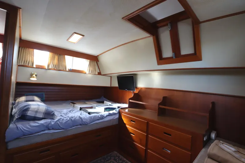 Slide: The Image of Cozy cabin interior of 1993 Grand Banks 46 Classic yacht with bed and wooden furnishings. - 74