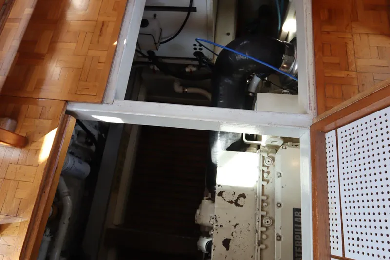 Slide: The Image of Engine room of 1993 Grand Banks 46 Classic yacht with visible parquet flooring. - 85