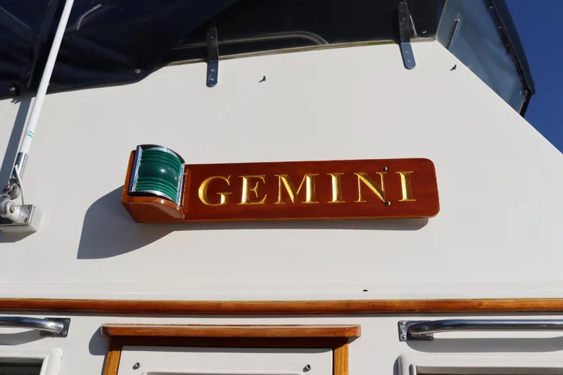 Slide: The Image of 1993 Grand Banks 46 Classic yacht with "Gemini" nameplate and green navigation light. - 9