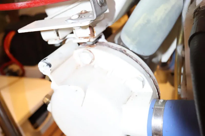 Slide: The Image of Engine component of 1993 Grand Banks 46 Classic yacht, featuring pipes and metal parts. - 94