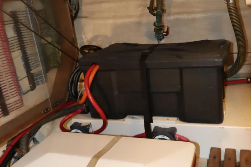 Slide: The Image of Engine room of 1993 Grand Banks 46 Classic with battery box and wiring. - 97