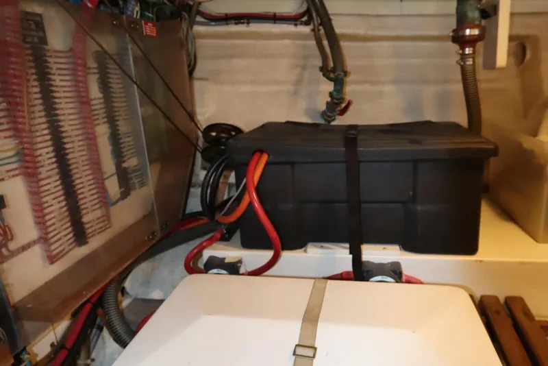 Slide: The Image of Electrical compartment of 1993 Grand Banks 46 Classic boat with wiring and battery box. - 99