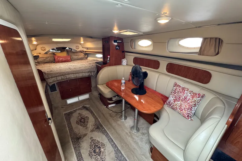 Slide: The Image of 2005 Rinker Fiesta Vee 342 cabin interior with cozy seating and elegant decor. - 21