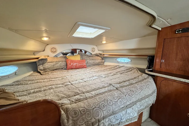 Slide: The Image of Luxurious cabin interior of 2005 Rinker Fiesta Vee 342 with cozy bedding. - 26