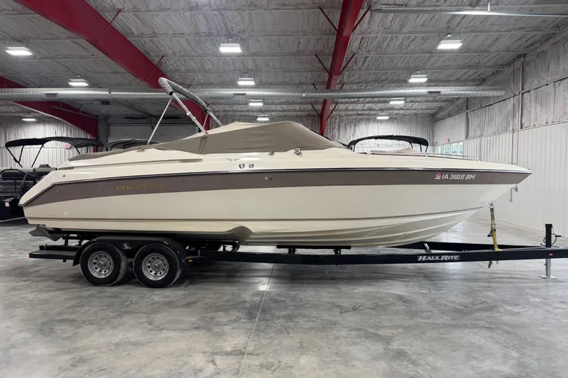 Slide: The Image of 1998 Regal 2800 LSR boat on trailer in indoor storage facility. - 3