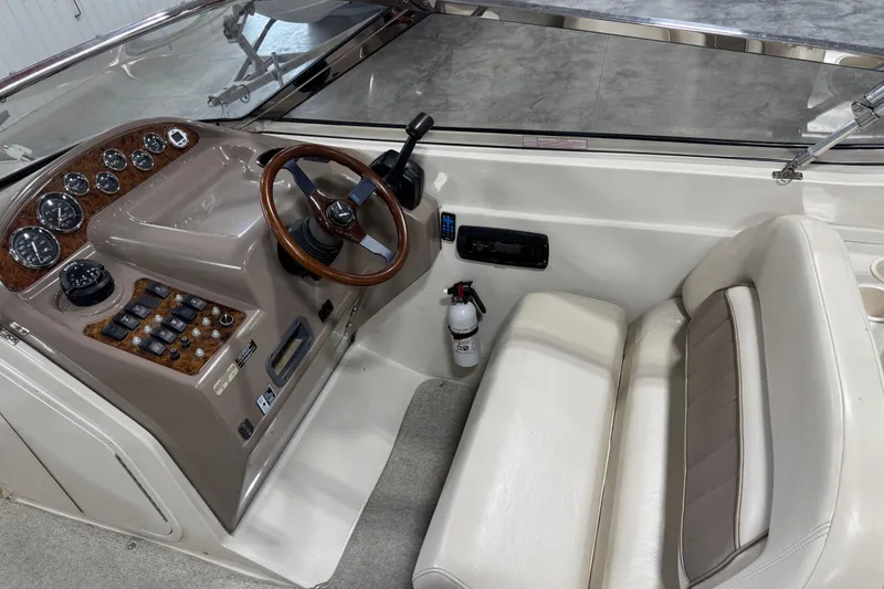 Slide: The Image of 1998 Regal 2800 LSR boat cockpit with steering wheel and control panel. - 7