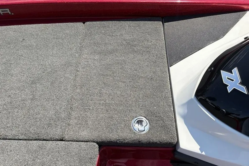 Slide: The Image of 2015 Skeeter ZX225 boat deck with gray carpet and red trim. - 17