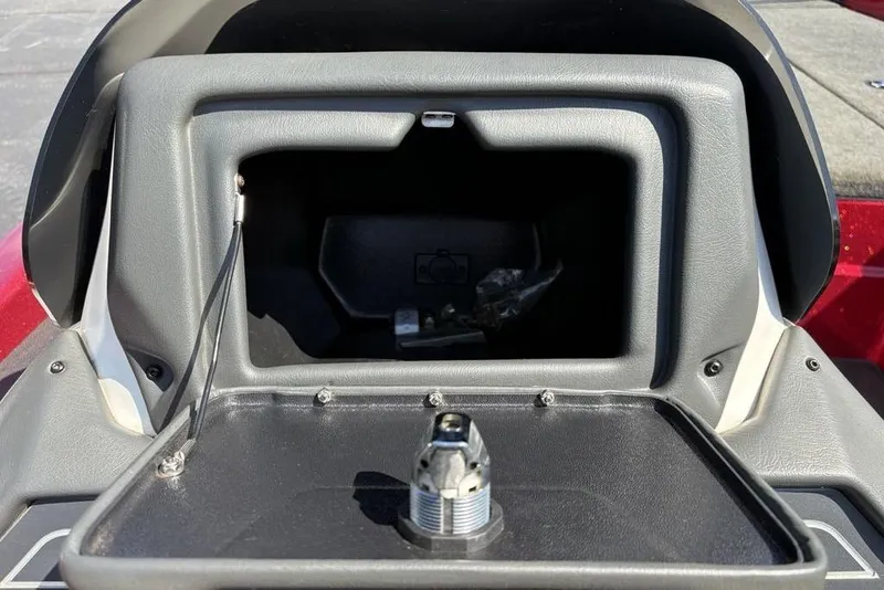 Slide: The Image of 2015 Skeeter ZX225 boat storage compartment with open lid and latch mechanism. - 18