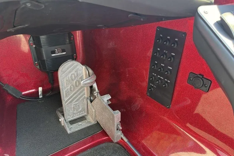 Slide: The Image of 2015 Skeeter ZX225 boat interior with control panel and foot pedal. - 20