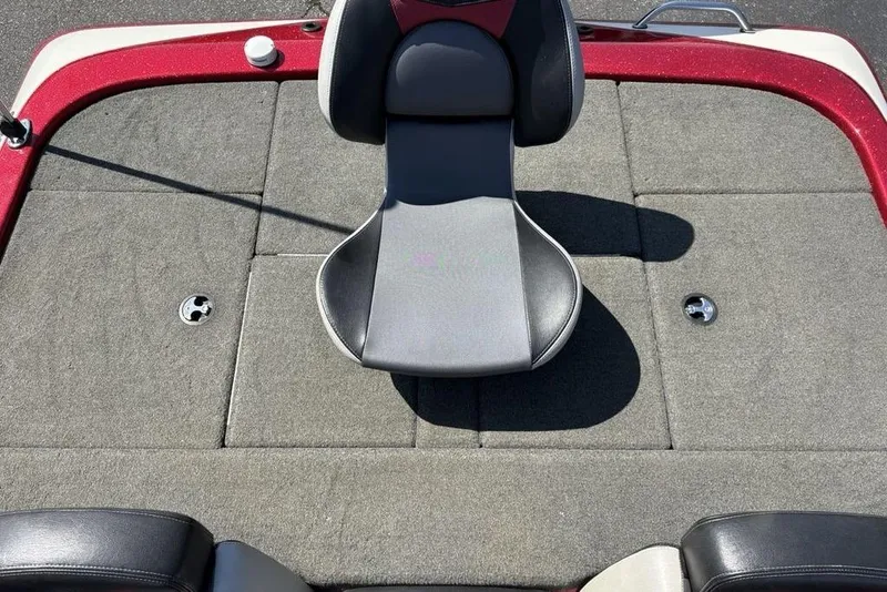 Slide: The Image of 2015 Skeeter ZX225 boat deck with gray seating and red accents. - 30