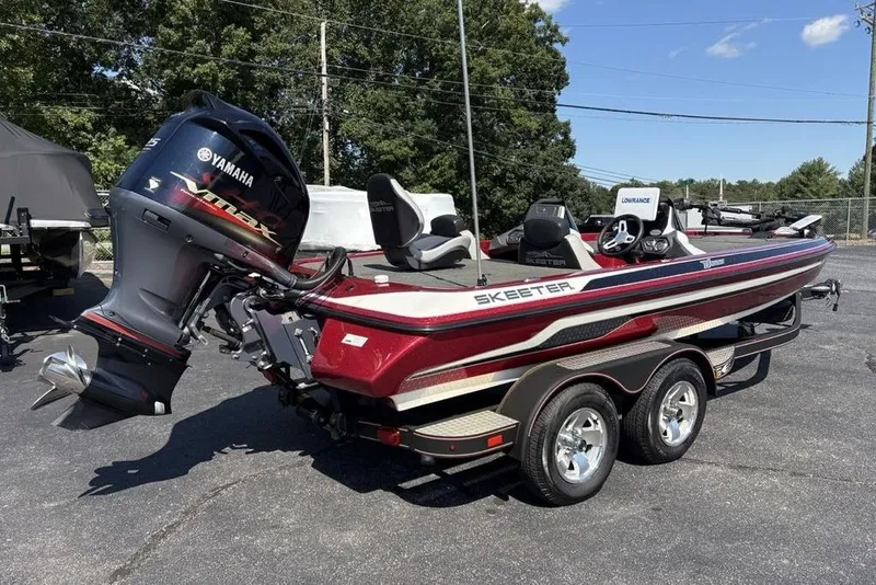 Slide: The Image of 2015 Skeeter ZX225 bass boat with Yamaha engine on a trailer. - 4