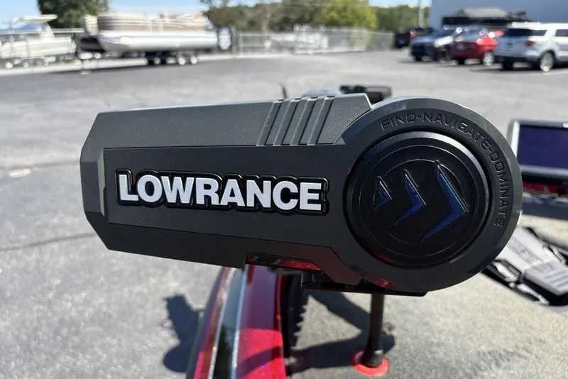 Slide: The Image of Lowrance device on 2015 Skeeter ZX225 boat, outdoor setting with vehicles in background. - 9