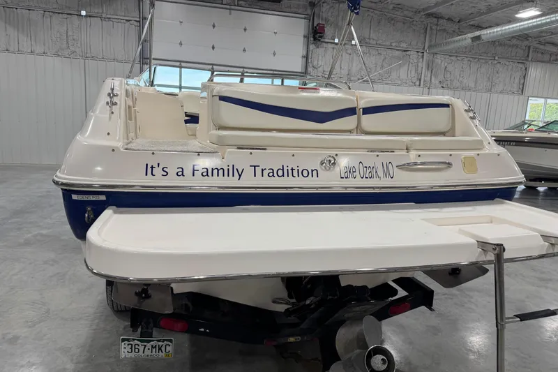 Slide: The Image of 2004 Rinker 282 Captiva Bowrider boat in a garage, labeled "It's a Family Tradition." - 14