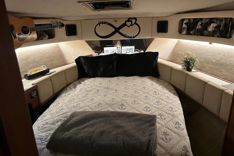 Slide: The Image of Cozy bedroom in 1994 Bayliner 3888 Motoryacht with nautical decor and guitar. - 18