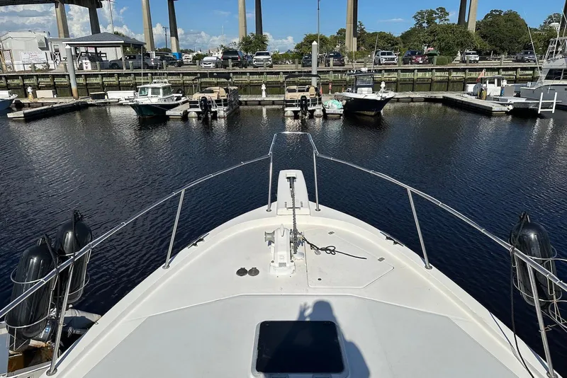 Slide: The Image of Bow view of 1994 Bayliner 3888 Motoryacht docked at marina. - 23